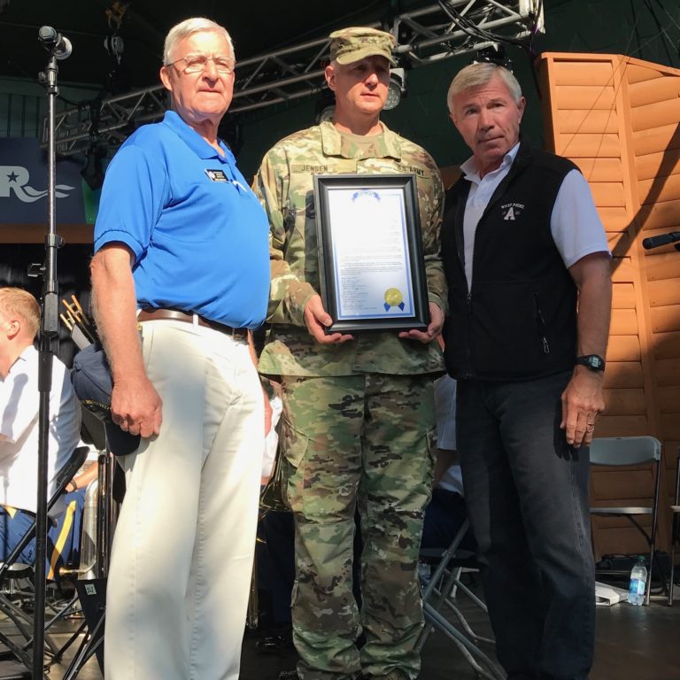 Sen. Bruce Anderson and Rep. Bob Dettmer present Maj. Gen. Jensen with resolution